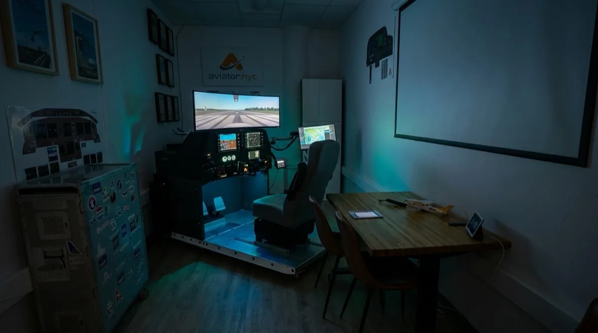 Aviator.NYC flight simulator training room at 35 West 31st Street, Suite 901, PFC GTX G1000 NXi AATD with evening session lighting in Midtown Manhattan
