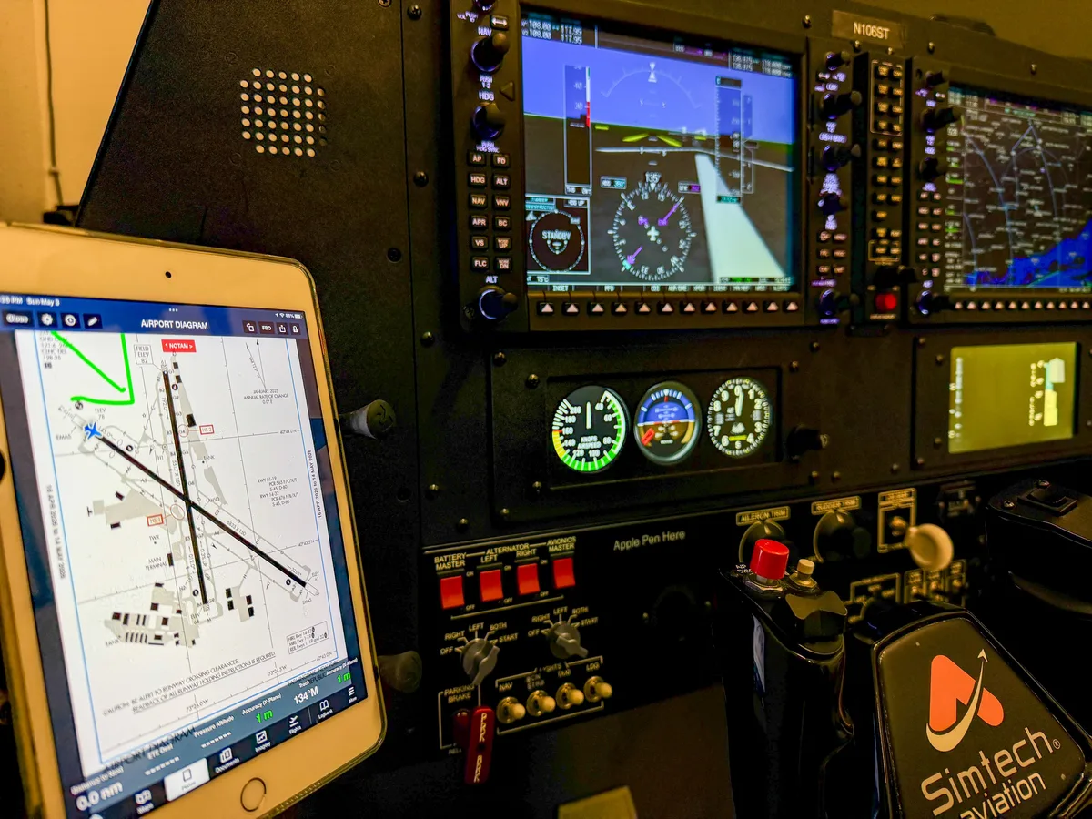 ForeFlight iPad EFB displaying airport diagram synchronized with G1000 NXi simulator at Aviator.NYC